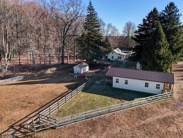 exterior space with a rural view and an outdoor structure