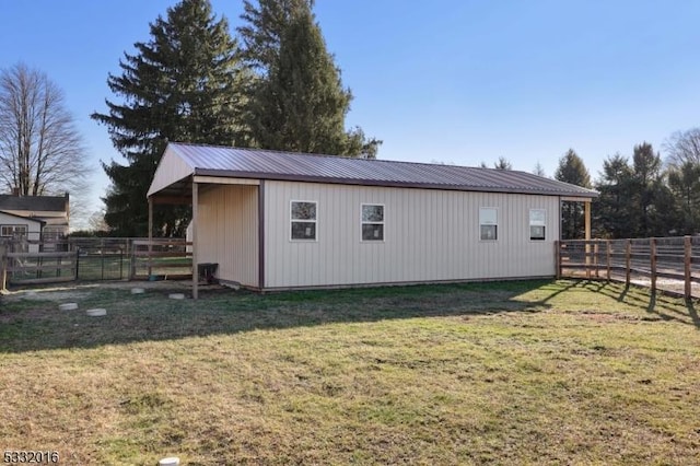 view of outbuilding with a lawn