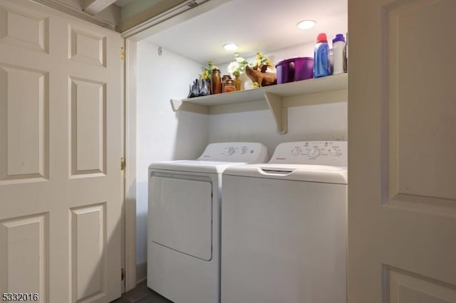 clothes washing area featuring washing machine and clothes dryer