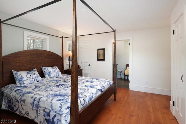 bedroom with hardwood / wood-style floors