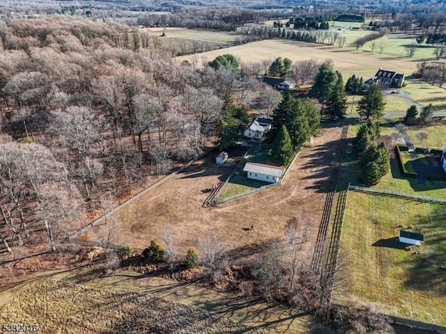 birds eye view of property with a rural view