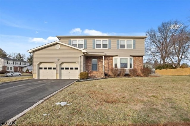 front of property featuring a garage and a front lawn