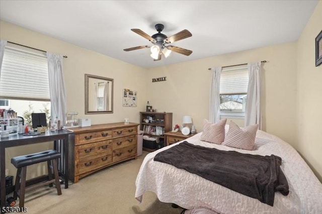 carpeted bedroom featuring ceiling fan