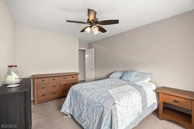 bedroom with ceiling fan and light colored carpet