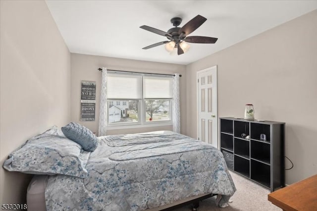 carpeted bedroom with ceiling fan