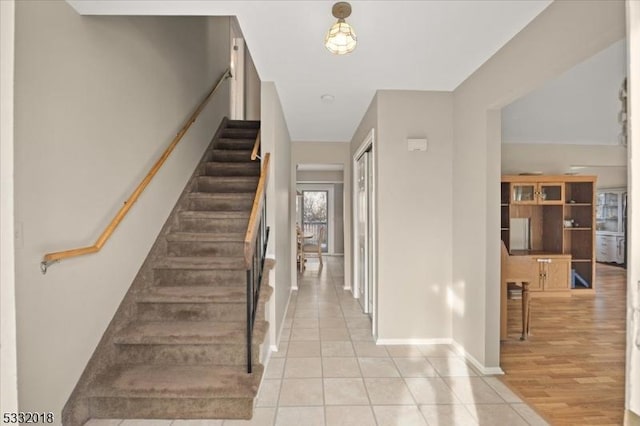 stairs with tile patterned flooring