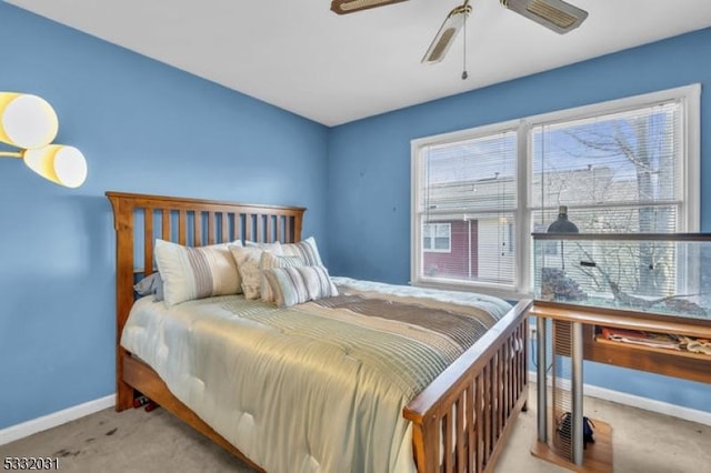 bedroom with light carpet and ceiling fan