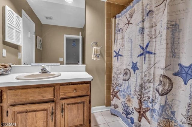 bathroom with tile patterned flooring, vanity, and a shower with curtain