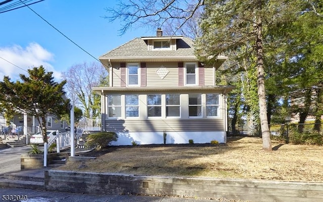 view of front of home featuring a sunroom