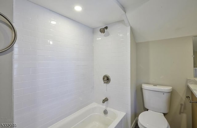 full bathroom featuring vanity, toilet, and tiled shower / bath combo