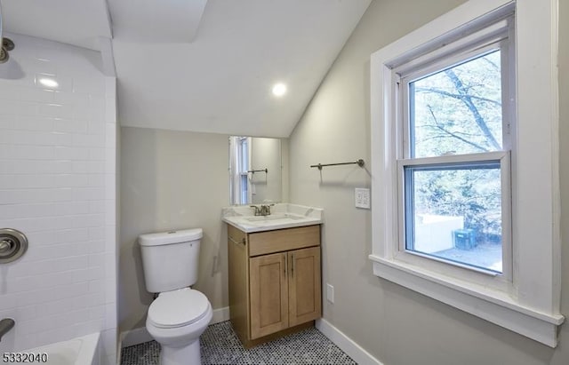 bathroom with vanity, toilet, and lofted ceiling