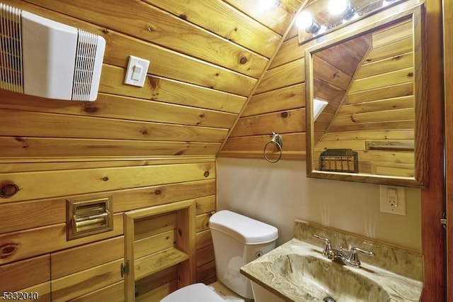 bathroom featuring lofted ceiling, toilet, wood ceiling, and sink