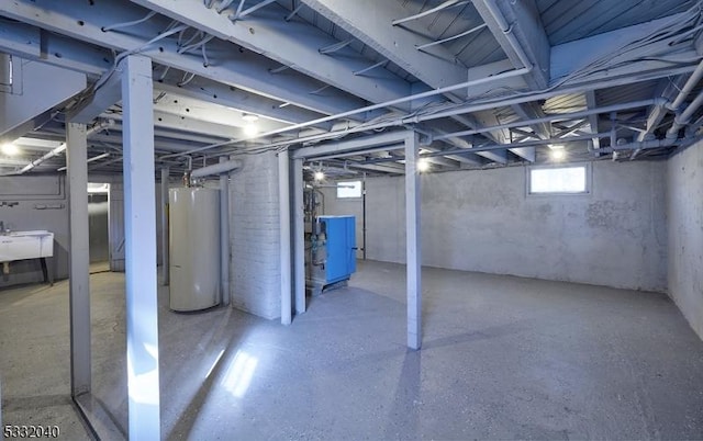 basement with gas water heater and sink