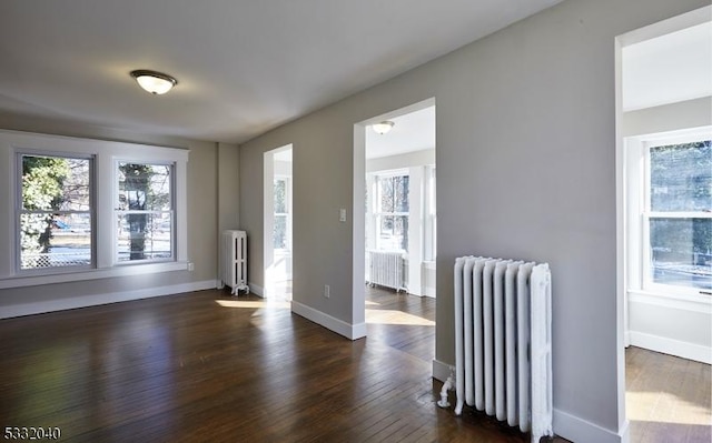 interior space featuring radiator and dark wood-type flooring