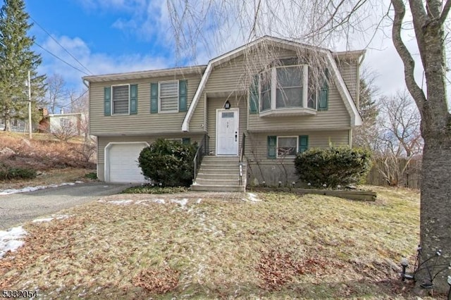 split foyer home featuring a garage