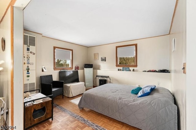 bedroom featuring light parquet floors