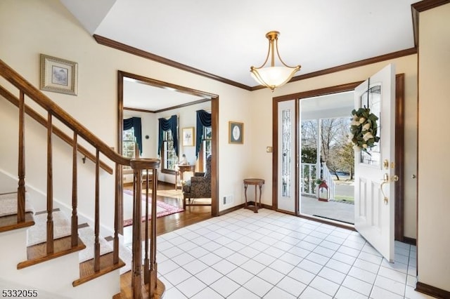 tiled entrance foyer with ornamental molding