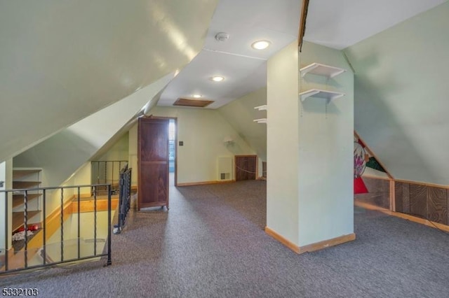 additional living space featuring carpet floors and lofted ceiling