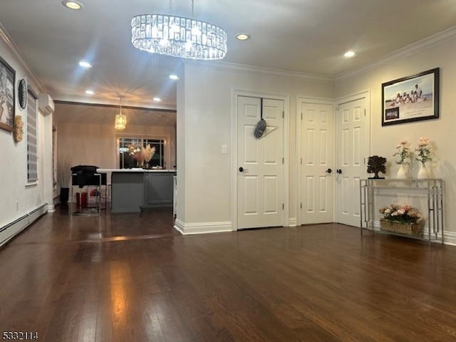 foyer entrance with a notable chandelier, dark hardwood / wood-style flooring, and crown molding