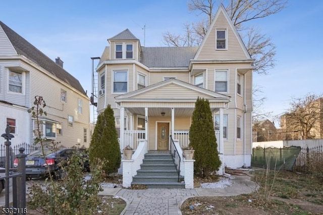 victorian house featuring a porch