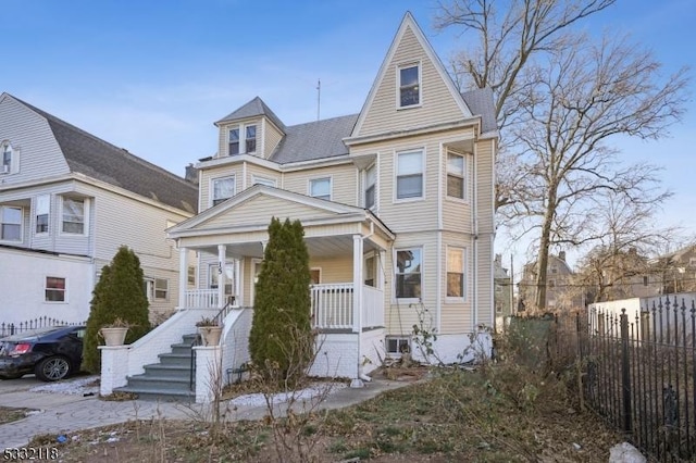 victorian-style house featuring a porch