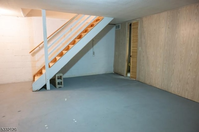 basement with wood walls