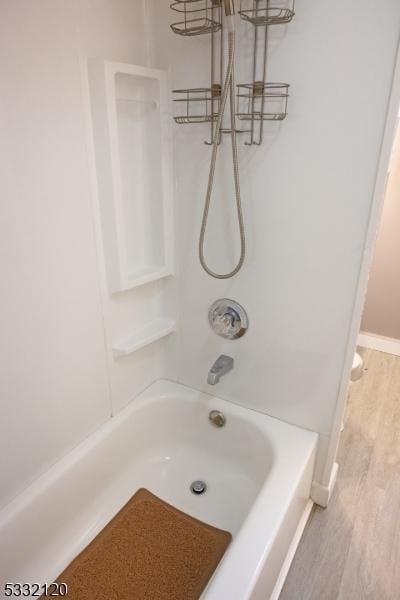 bathroom with shower / washtub combination