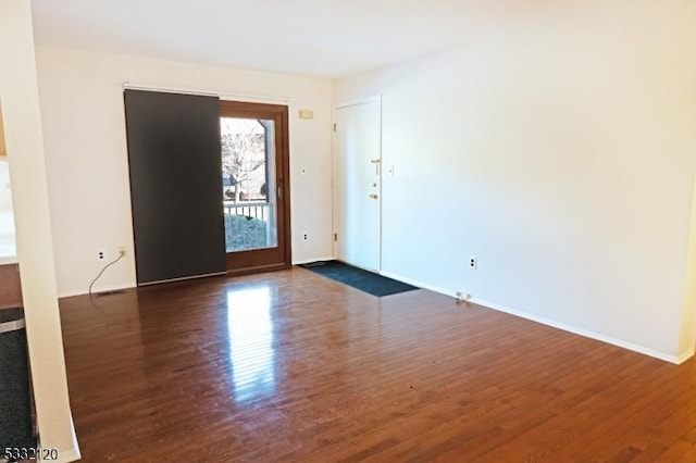 interior space with dark wood-type flooring