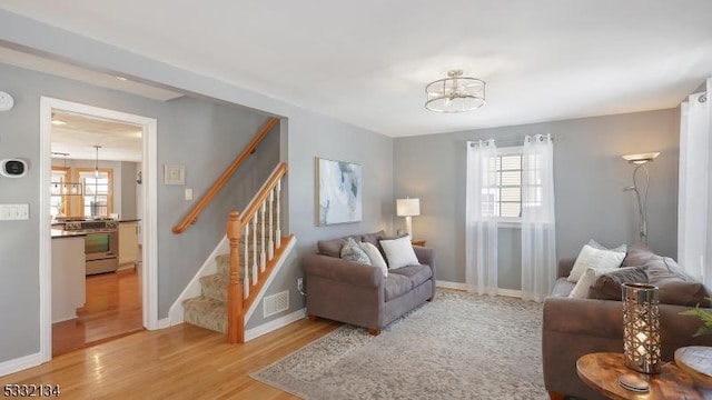 living room with light hardwood / wood-style floors