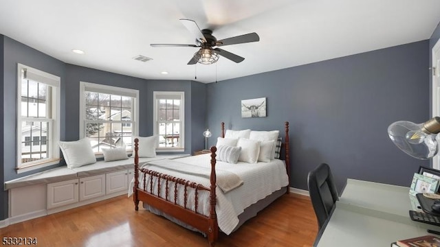 bedroom featuring wood-type flooring and ceiling fan