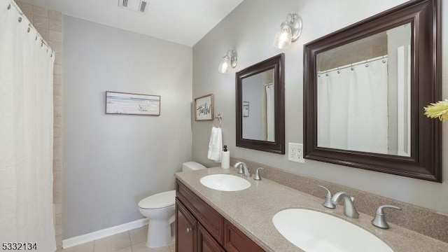 bathroom featuring vanity, toilet, a shower with shower curtain, and tile patterned flooring