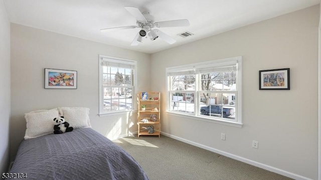 bedroom with ceiling fan and carpet floors