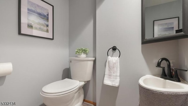 bathroom with sink and toilet