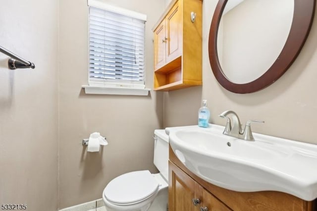 bathroom featuring toilet and vanity