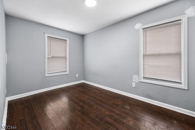 empty room with hardwood / wood-style floors