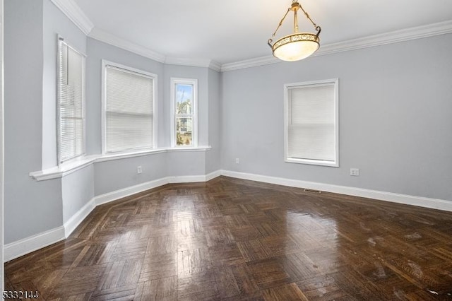 spare room featuring crown molding and dark parquet flooring