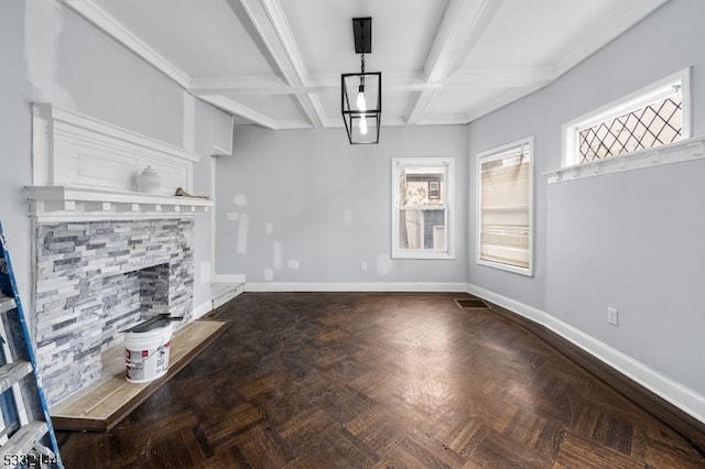 unfurnished living room featuring beam ceiling, dark parquet flooring, and coffered ceiling