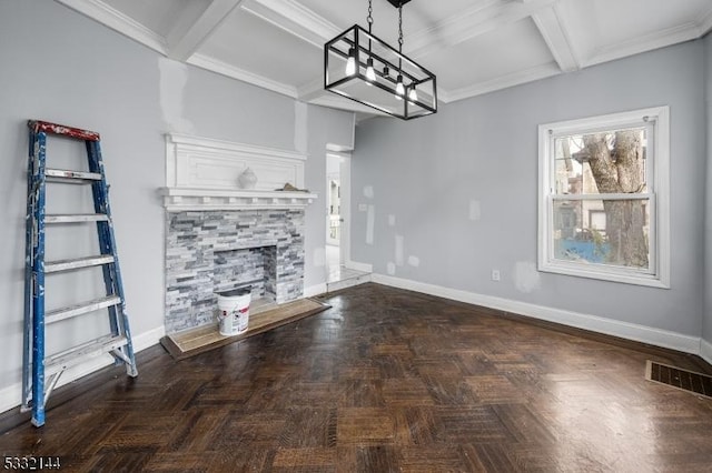 unfurnished living room with coffered ceiling, beam ceiling, dark parquet floors, and a stone fireplace