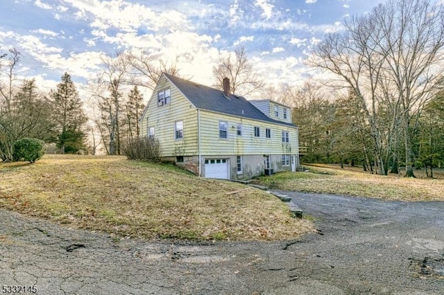 view of side of home with a garage