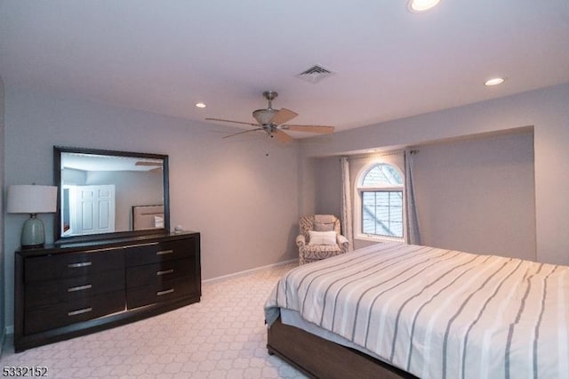 bedroom with ceiling fan and light colored carpet