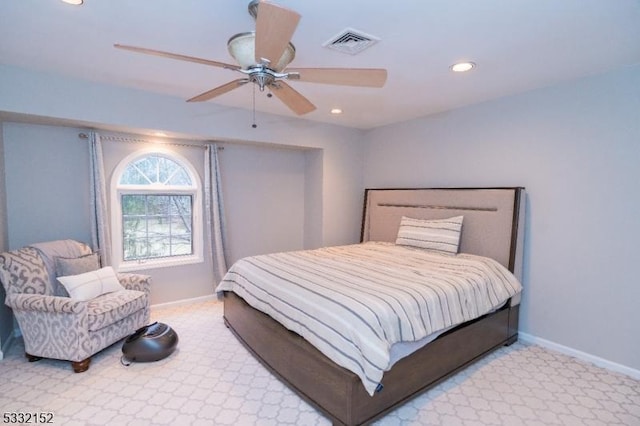 bedroom with ceiling fan and light carpet