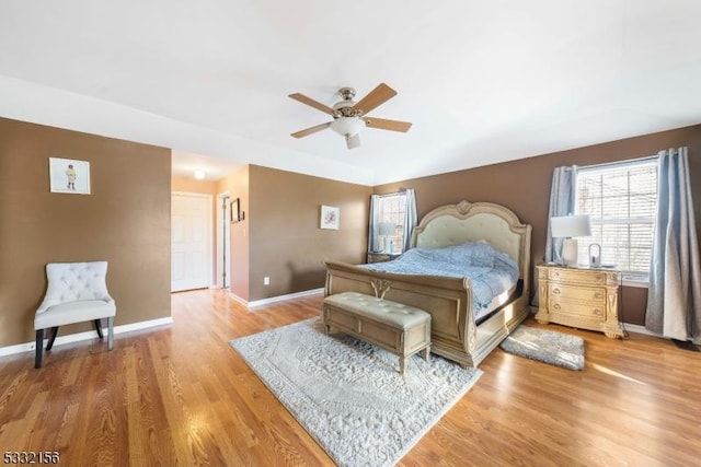 bedroom with ceiling fan and hardwood / wood-style floors