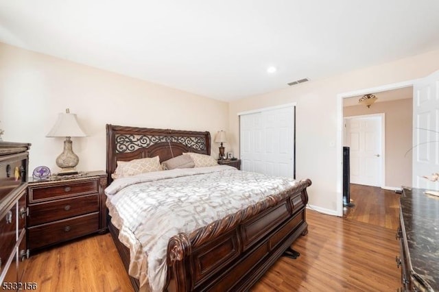 bedroom featuring a closet and light hardwood / wood-style flooring