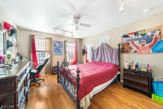 bedroom with ceiling fan and light hardwood / wood-style floors