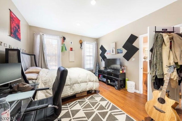 bedroom featuring wood-type flooring