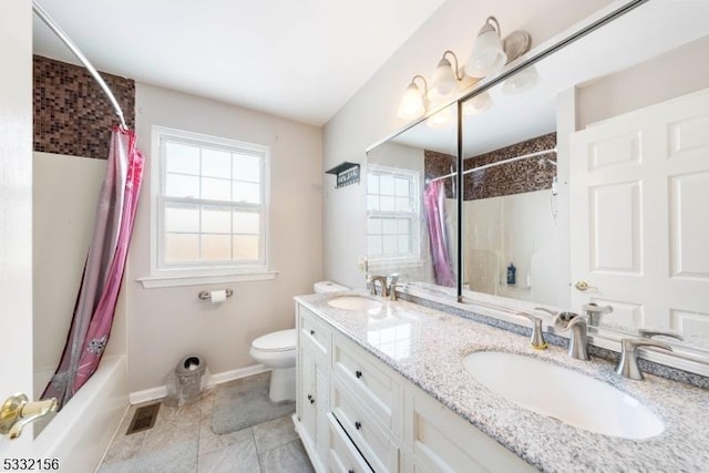 full bathroom featuring vanity, toilet, and shower / bath combo