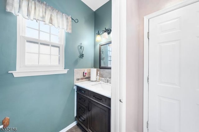 bathroom with vanity and backsplash