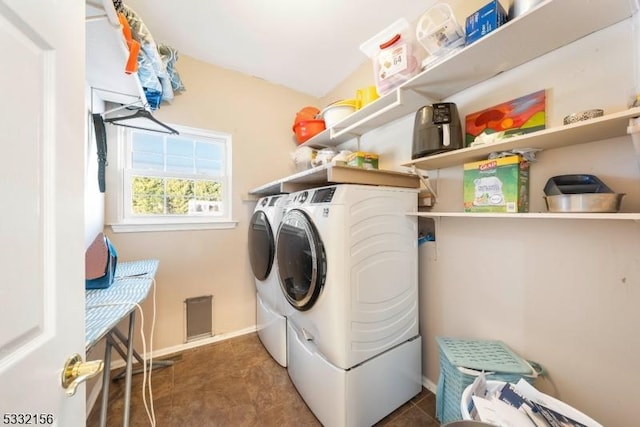 laundry room with independent washer and dryer