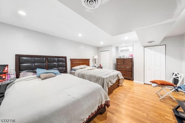 bedroom with light hardwood / wood-style flooring