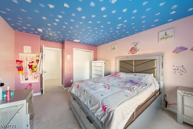 carpeted bedroom featuring a closet